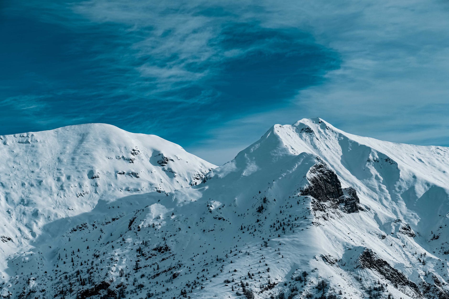 snow covered mountain under blue sky