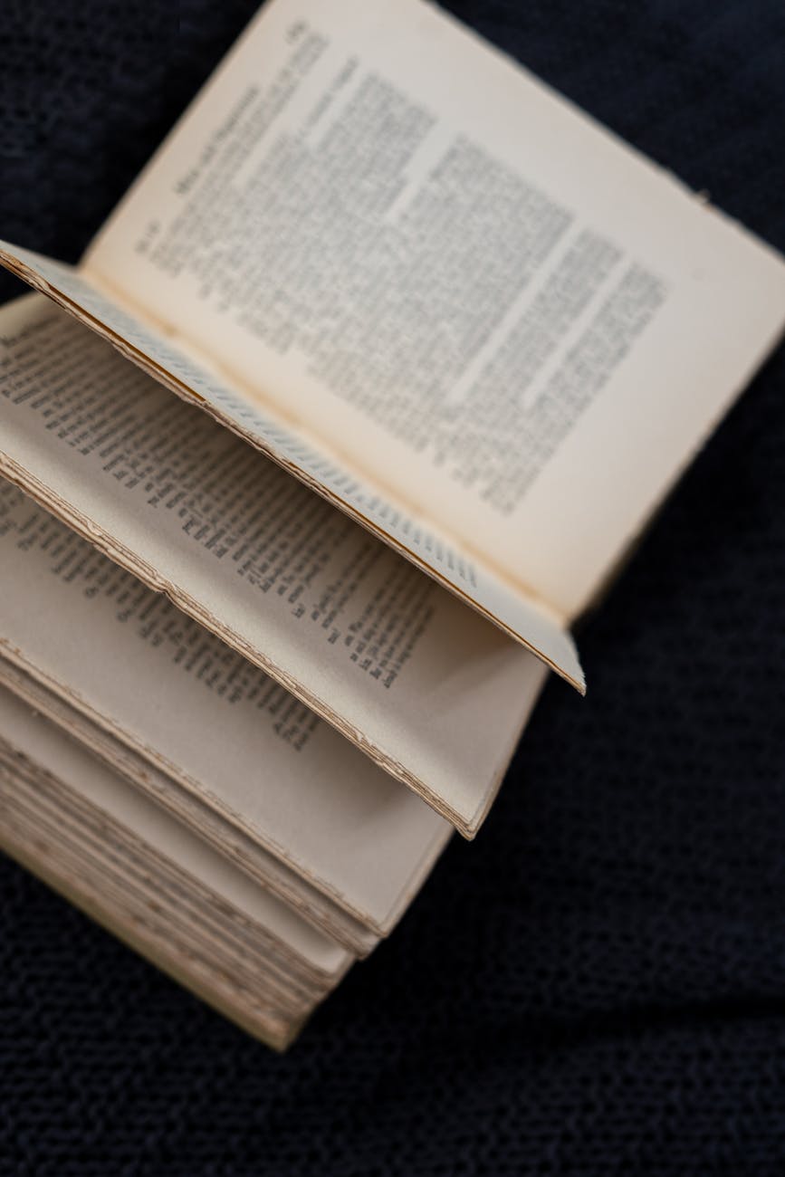 white book page on black textile