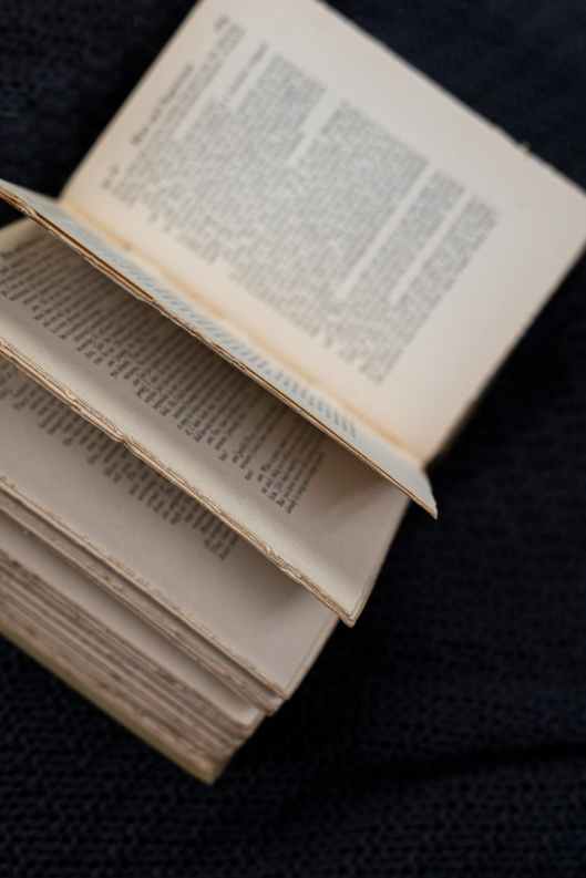 white book page on black textile