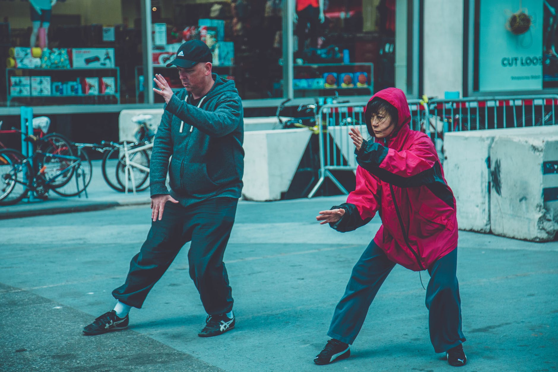 photo a man and woman doing martial arts